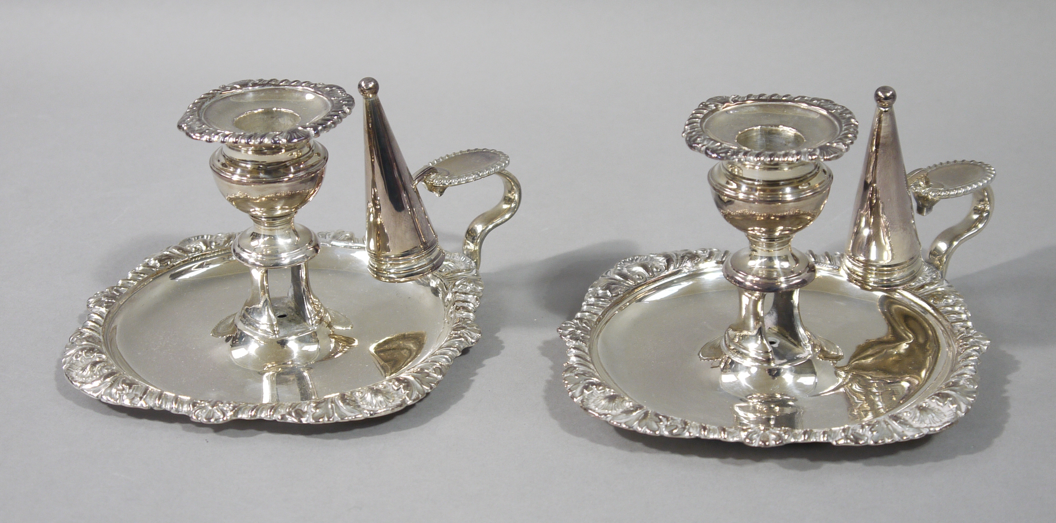 A pair of Victorian style silver plated chamber sticks with conical shaped snuffers, - Image 2 of 2