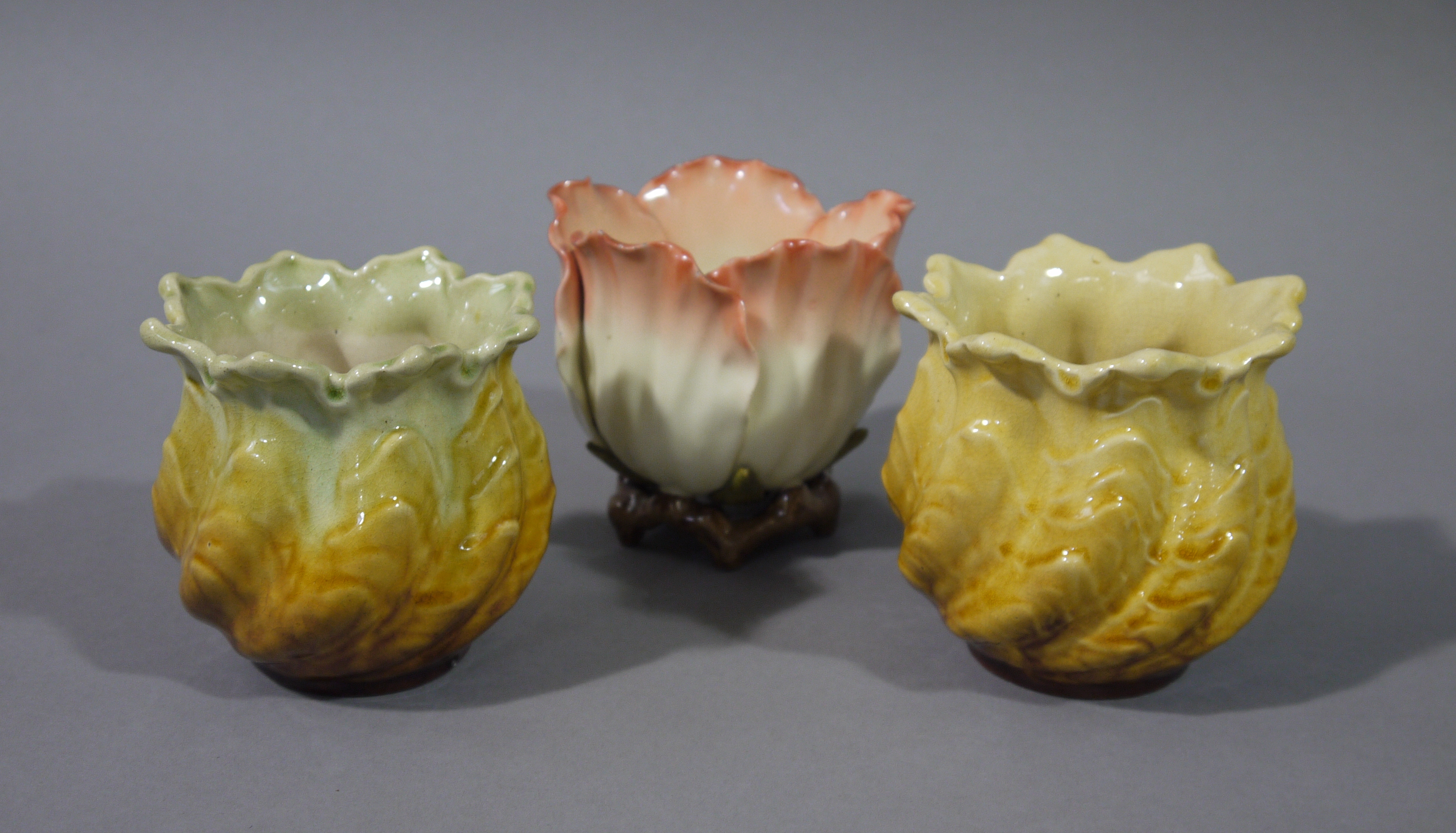 A pair of Leeds pottery spiral moulded leafy small jardinieres or vases,