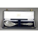 A silver plated sifter spoon with foliate pierced and engraved bowl tine and terminal,