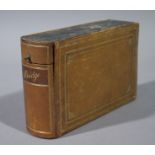 A leather cased faux book the hinged lid revealing pair of cards the spine gilt tooled 'Bridge',