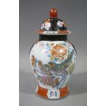 A Chinese baluster vase and cover painted with birds on flowering branches on a gilt scroll black