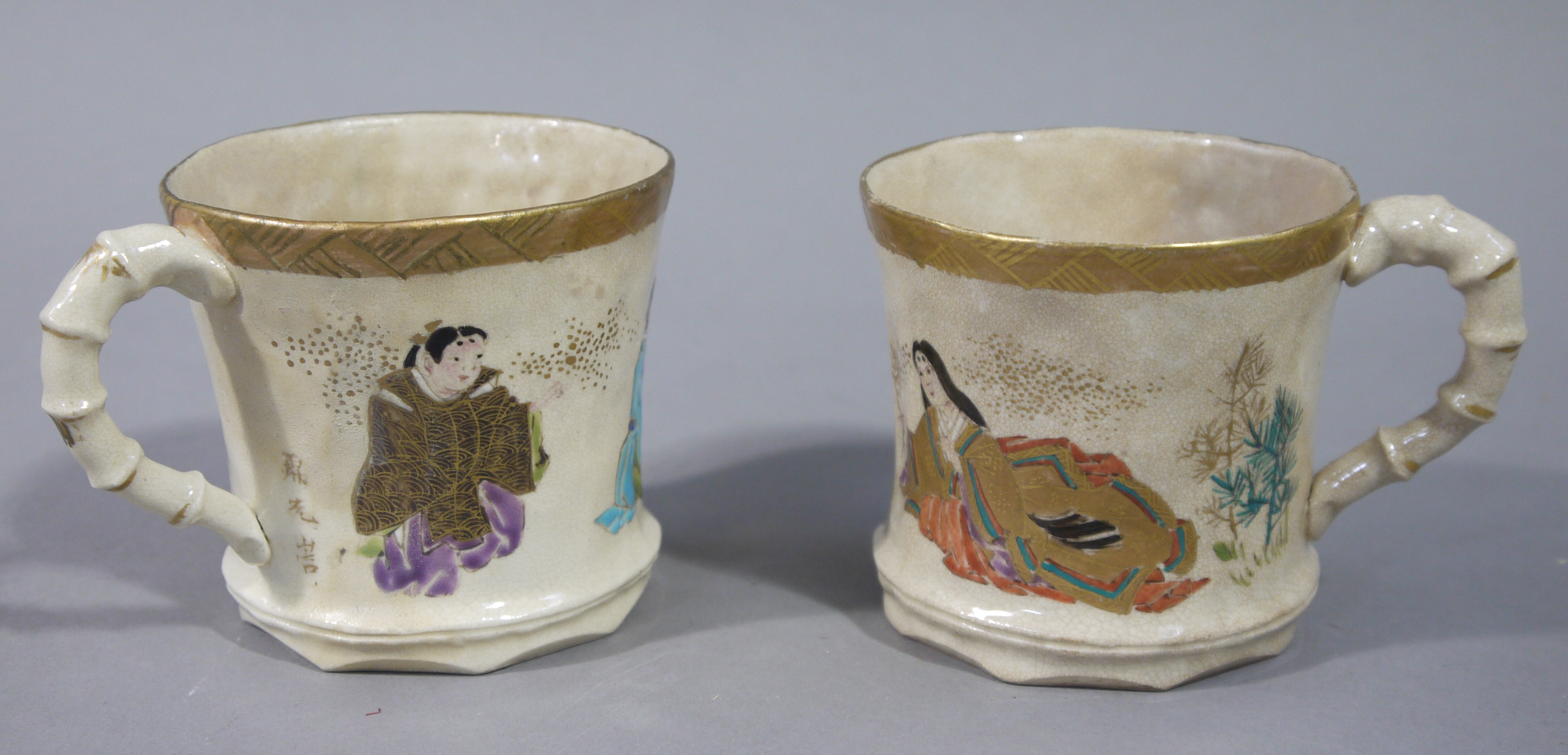 A pair of Japanese satsuma pottery waisted cylindrical mugs with faux bamboo moulded handles the - Image 2 of 2