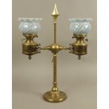 A VICTORIAN BRASS TWO ARM OIL LAMP,