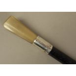 A VICTORIAN GENTLEMAN'S EBONISED HARDWOOD WALKING STICK with tapered octagonal horn pommel,