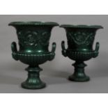 A PAIR OF VICTORIAN CAST IRON GARDEN URNS of campagna form with scrolling acanthus leaf bands,