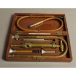 ARNOLD & SONS, WEST SMITHFIELD, LONDON, a Victorian white metal and brass enema set,