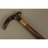 A GENTLEMAN'S TAPERED BAMBOO WALKING STICK with tortoiseshell handle and reeded gold plated collar,