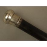 A GEORGE V GENTLEMAN'S TAPERED ROSEWOOD WALKING STICK with plain silver pommel, Birmingham 1911,