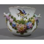 A continental porcelain floral encrusted two-handled jardiniere painted with birds and butterflies