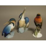 A Rosenthal model of a red breasted bird; together with two Bing and Grondahl figures of birds,