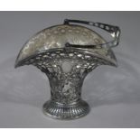 A silver plated basket of waisted inverted form, swing handle with central oval cartouche,