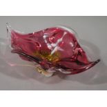 An Art glass petal bowl of cranberry to orange colour,