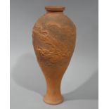 A terracotta baluster vase with cylindrical neck impressed Greek key border,