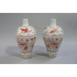 A pair of reproduction Chinese baluster vases with shallow cylindrical necks,