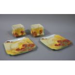 A pair of Royal Doulton shaped square plates transfer printed and painted with a poppy field and