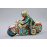 A tin plate motorcycle and rider,