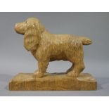 Catman - a carved wooden figure of a dog on rectangular base,