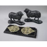 A pair of Victorian cast iron sheep door stops,