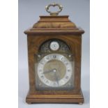 Elliott - a George I style walnut veneered bracket clock with lacquered brass carrying handle,