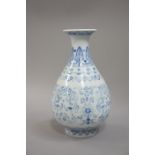 A reproduction Chinese blue and white vase of baluster form with everted neck,