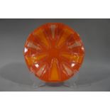 A late 20th century orange glass plaque signed Higgins in gilt to the rim,