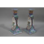 A pair of 20th century Chinese candlesticks printed and enamelled with birds and blossom against a