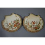 A pair of Royal Worcester shaded apricot ground cabinet plates of pierced cartouche shape painted