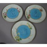 A set of three Victorian pottery plates each painted to the centre with a turquoise circular