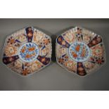 A pair of late 19th/early 20th century Imari chargers of hexagonal outline painted in alternating