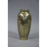 A Chinese brass vase, ovoid, with two stylised masks to the shoulder an incised dragon decoration,