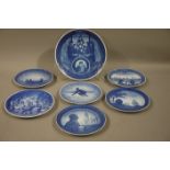 Seven Royal Copenhagen Commemorative plates, 24cm diameter and 18cm diameter approx,