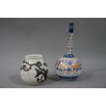 A Japanese crackle glaze ovoid vase decorated in stoneware with blossom tree and crane;