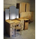 A six piece Art Deco style oak veneer bedroom suite comprising wardrobe, tall boy, dressing table,