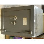 A safe, bearing label for Withy Grove Stores (Leeds) Ltd Safe Merchants Office Furnishers,