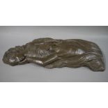 A cast bronzed resin sculpture/wall plaque in the form of a man and woman embracing,
