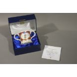 A Coalport Royal Wedding loving mug, number 37, Mulberry Hall, York, together with certificate,