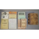 A quantity of sheet music and Webster New International Dictionary, tooled calf boards,