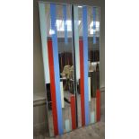 A pair of rectangular wall mirrors formed from pale green, red, blue and yellow and mirror strips,