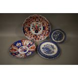 Two large Imari plates and various blue and white plates