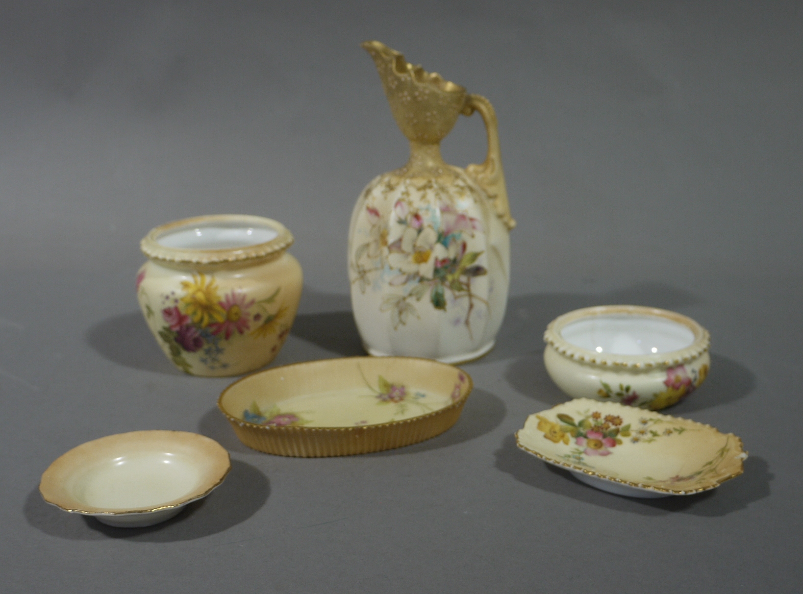 A Royal Worcester baluster vase painted with summer flowers on a shaded apricot ground,