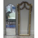 A giltwood and gesso wall mirror of arched rectangular outline,