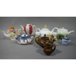 A quantity of decorative teapots, various manufacturers including cauliflower, floral coloured.