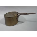 Large copper saucepan and cover with iron handle