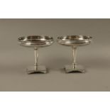 A pair of EPNS tazzas the shallow circular bowls with Greek key rims on trumpet shaped stems,