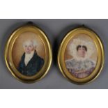 A pair of Victorian portrait miniatures, half length, of a gentleman in high collar,