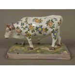 A Keller and Guerrin Luneville faience figure of a bull,