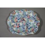 A Grimwades Royal Winton chintz pattern hors d'oeuvres dish, gilt lined rim,