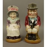 Sarreguemines - a pair of character jugs, 33cm high,