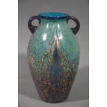 A gilt speckled two handled vase of purple to green colour with purple loop handles,19.