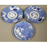 Two similar Chinese blue and white plates each with three panels and decorated to the centres